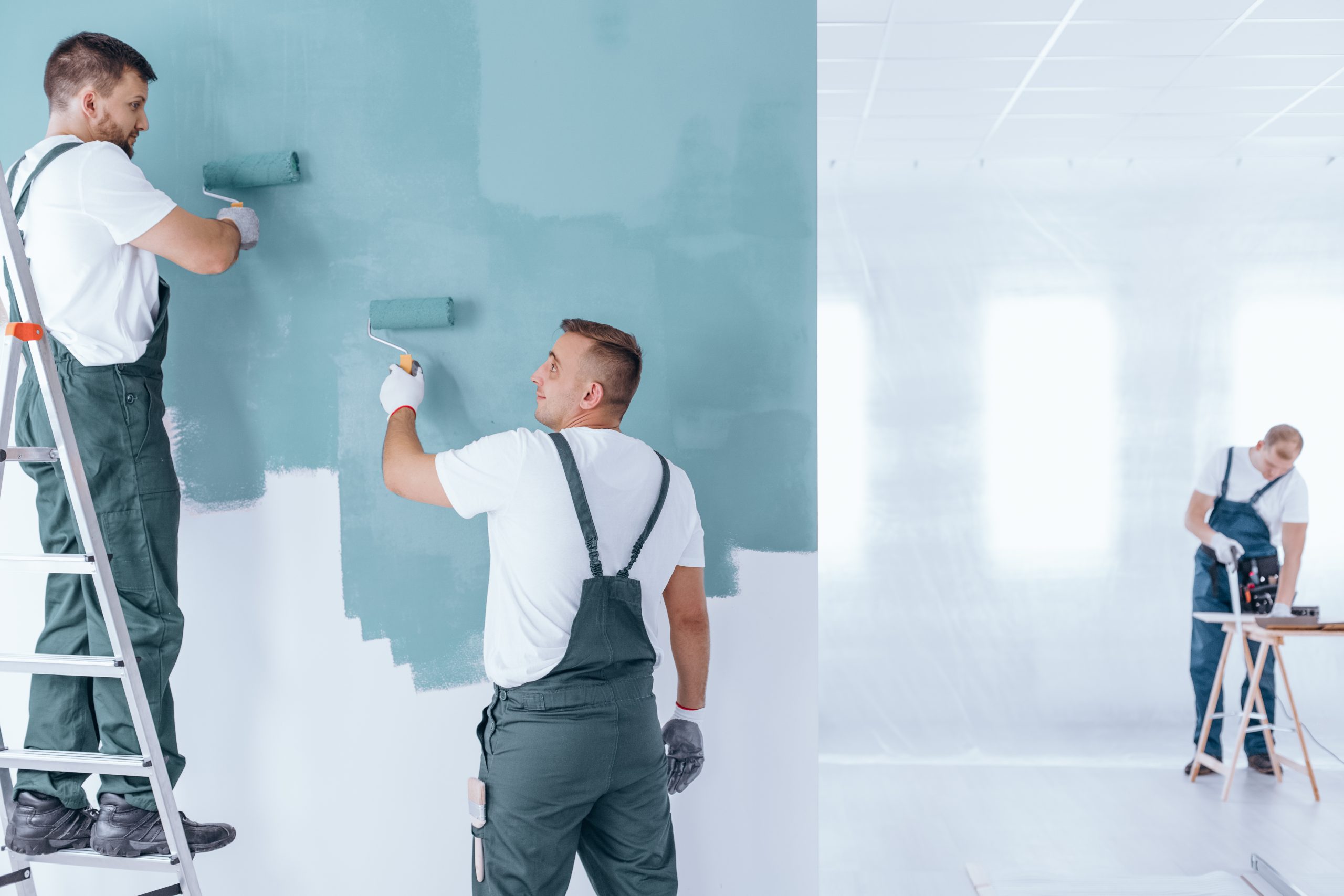 men painting empty home interior 2021 08 26 15 43 17 utc scaled - Our Services